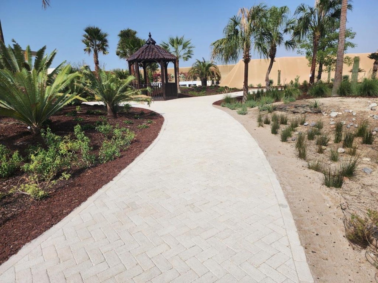 Partanna pavers leading to a garden pergola.